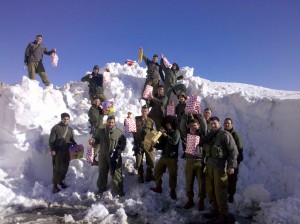 Soldiers in Snow IDF Soldiers in front of large mound of snow
